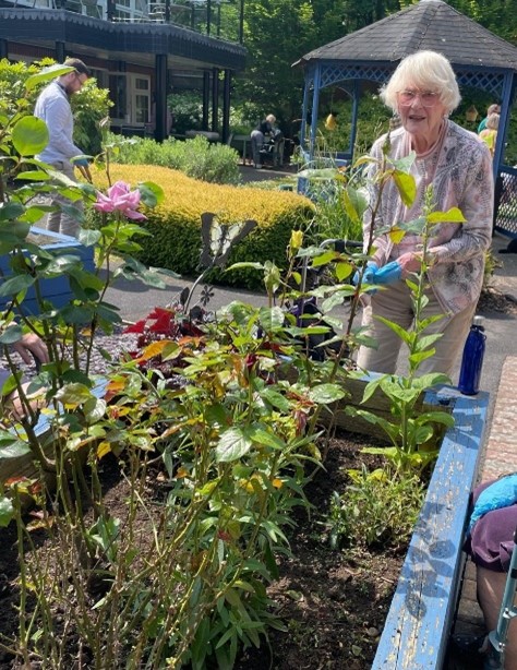 A resident at Sir Aubrey Ward Marlow gardening project