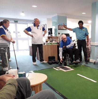 Residents at The Heights care home participating in a bowling competition