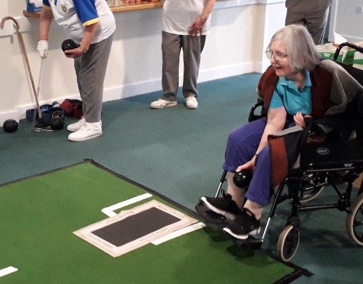 Residents at The Heights care home participating in a bowling competition