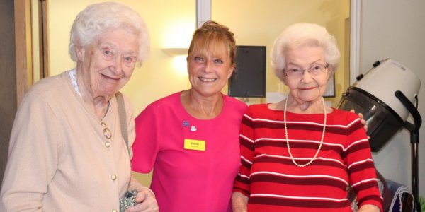 Denise with two residents in her salon