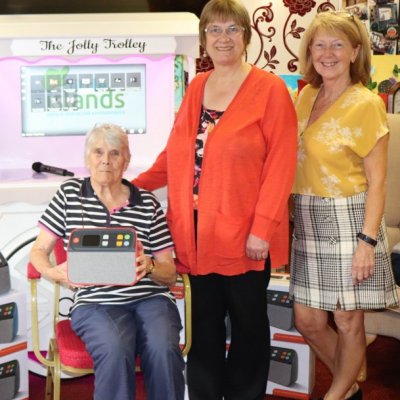 Residents and guests with Jolly Trolley